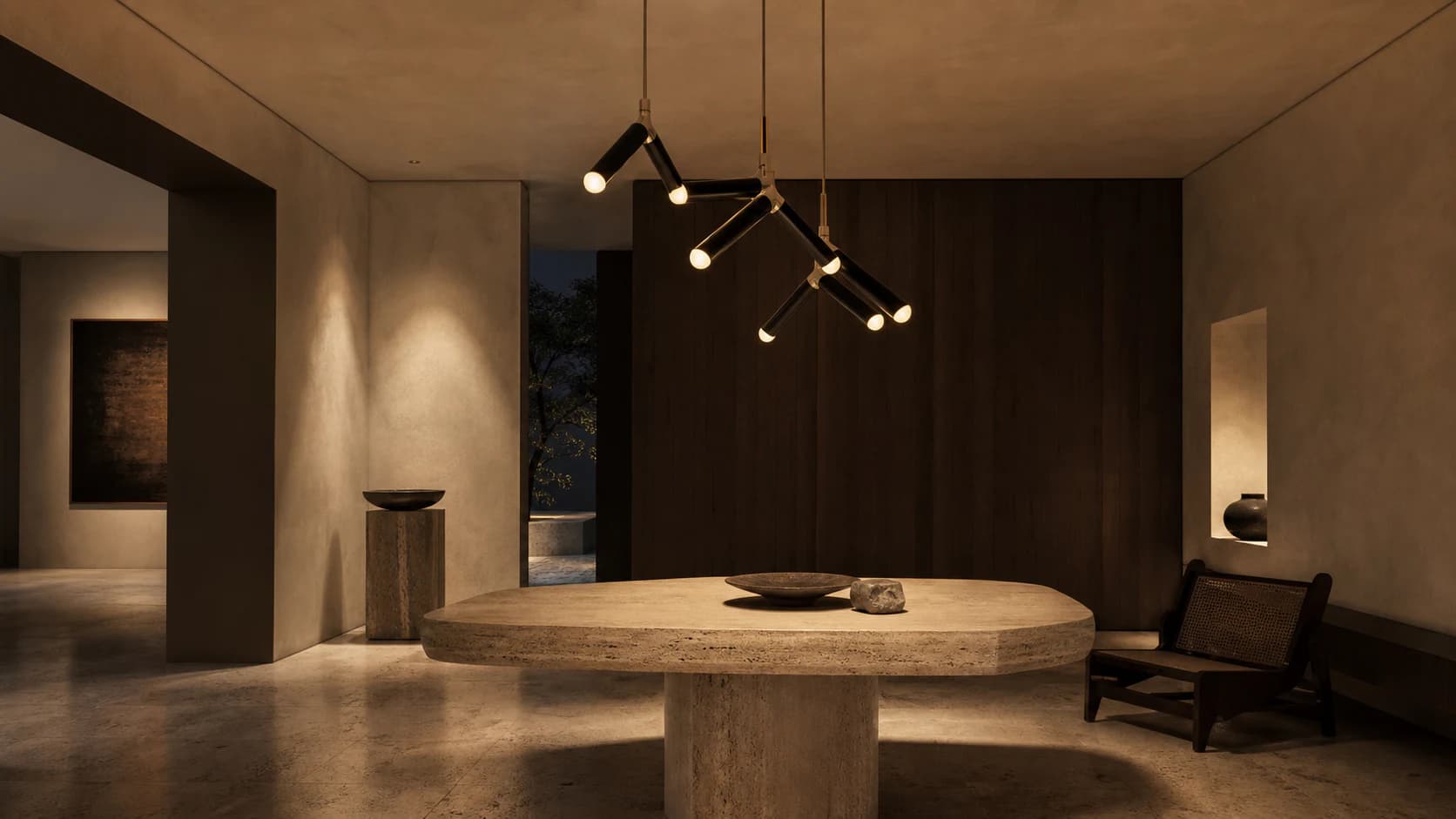 Unoccupied gallery lounge with Onda light above a travertine table